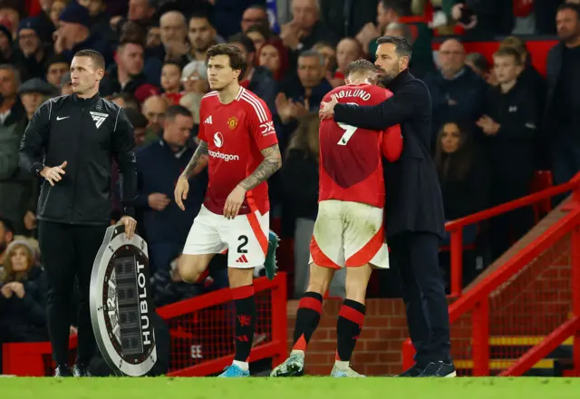 Manchester United's Rasmus Hojlund with interim manager Ruud van Nistelrooy after being substituted