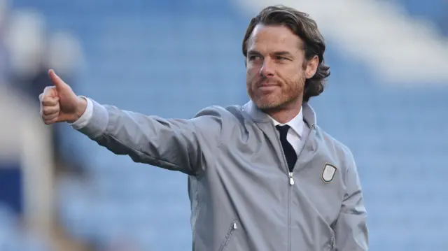 Burnley manager Scott Parker gives a thumbs-up to the fans