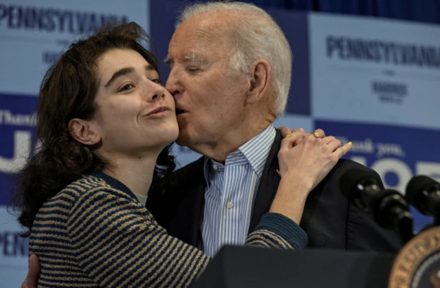 oe Biden kisses his granddaughter Natalie Biden during Carpenter’s Local 445 GOTV event in Scranton, Pennsylvania