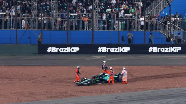 Stewards removing Lance Stroll's car from the track