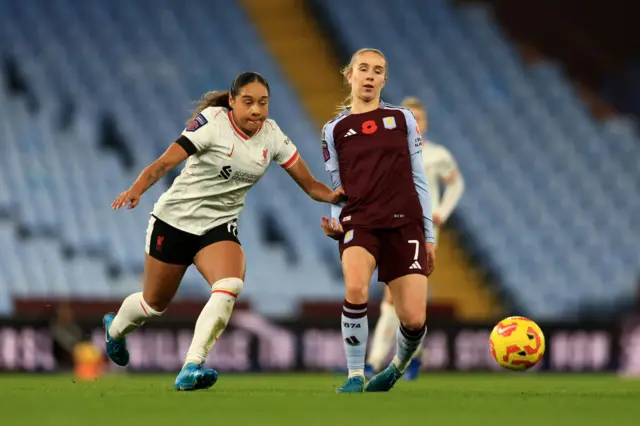 Missy Bo Kearns of Aston Villa is challenged by Olivia Smith of Liverpool