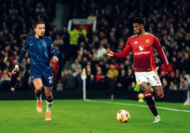 Marcus Rashford of Manchester United in action with Malo Gusto of Chelsea