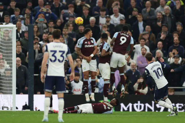 Tottenham Hotspur's English midfielder #10 James Maddison (R) scores their fourth goal