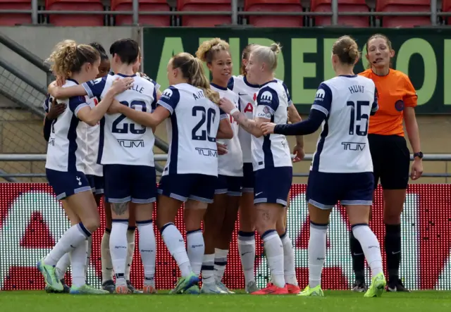 Tottenham celebrate with Gunning-Wiliams after she forced a late winner