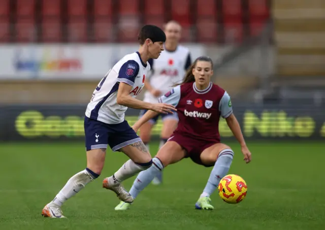 Ashleigh Neville dribbles through midfield