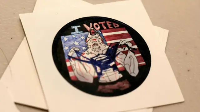 A round black sticker features a werewolf as it howls and tears off a shirt in front of an American flag