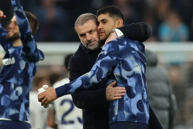 Tottenham Hotspur's Greek-Australian Head Coach Ange Postecoglou (L) celebrate