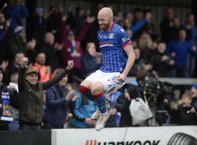 Chris Shields celebrates after slotting his injury-time penalty which completed a 3-1 win for Linfield over Carrick Rangers at Taylors Avenue