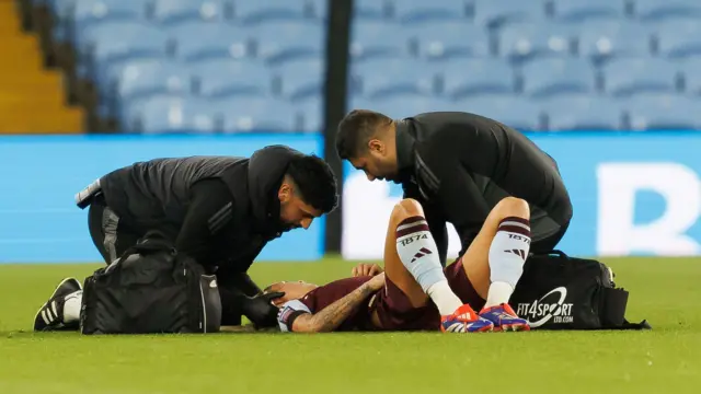 Rachel Daly is checked by physios as she lies on the floor