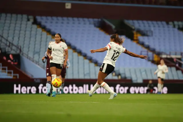 Taylor Hinds shoots with her right foot