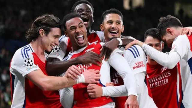 Gabriel of Arsenal celebrates scoring his team's third goal with teammates