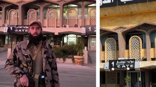 A fighter affiliated with HTS rebel group is shown at Aleppo International Airport.