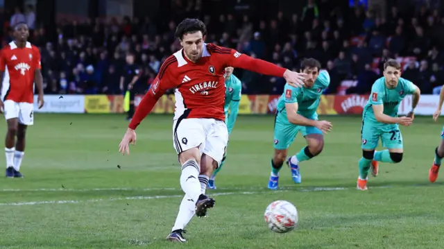 Cole Stockton converts from the spot for Salford City