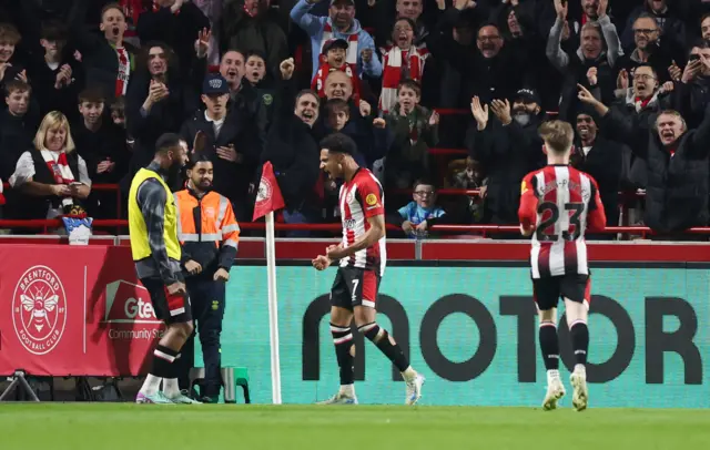 Brentford's Kevin Schade celebrates scoring their side's fourth goal .