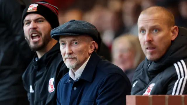 Swindon Town manager Ian Holloway watches on.