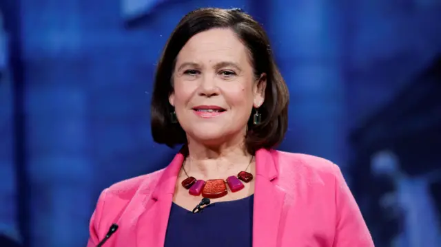 Mary Lou McDonald wearing a pink blazer with a navy top