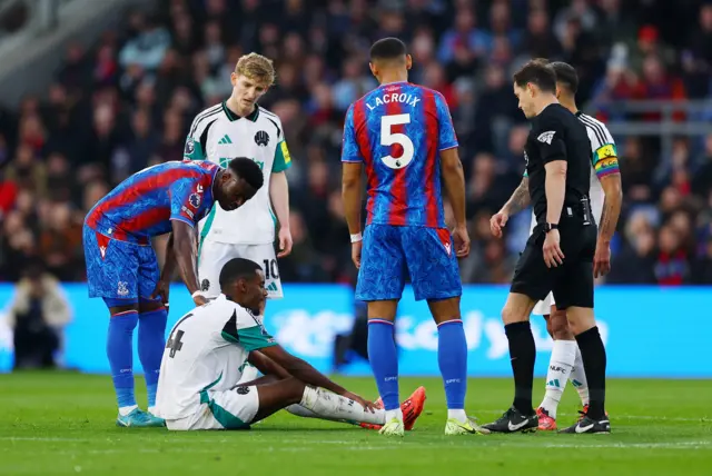 Newcastle United's Alexander Isak reacts after sustaining an injury