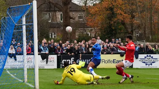 Wealdstone's Alex Reid places his shot over the Wycombe crossbar