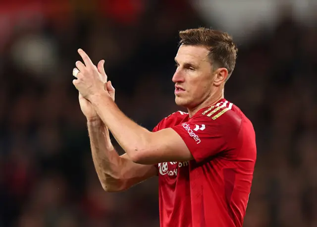 Chris Wood of Nottingham Forest applauds the fans