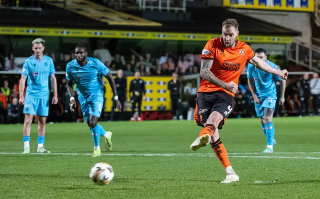 Dundee United's Kevin Holt scores from the penalty spot to make it 1-0