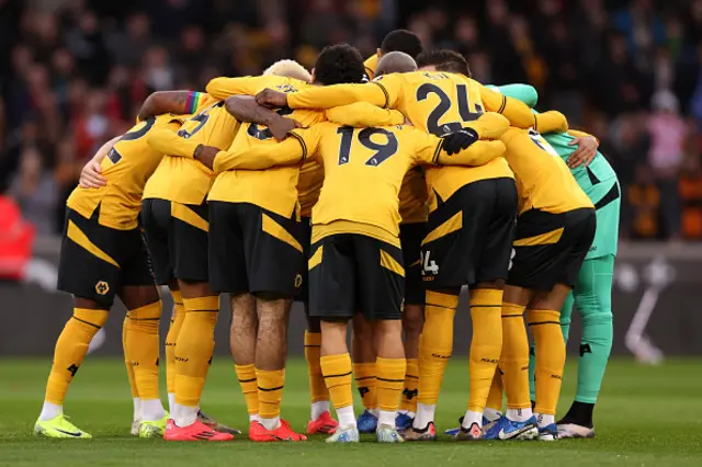 Players of Wolverhampton Wanderers huddle