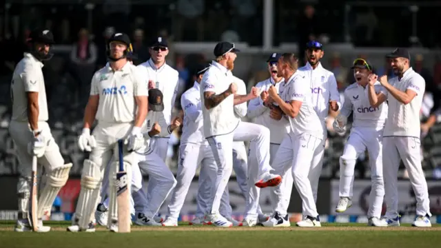 England celebrating a wicket