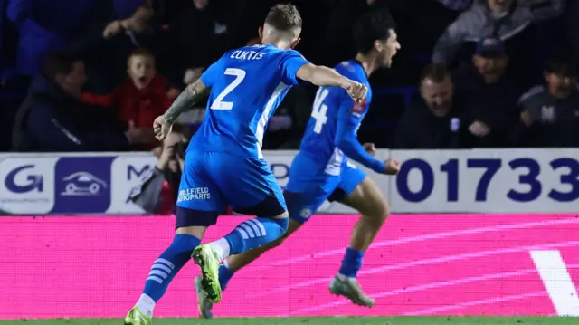 Joel Randall celebrates scoring for Peterborough