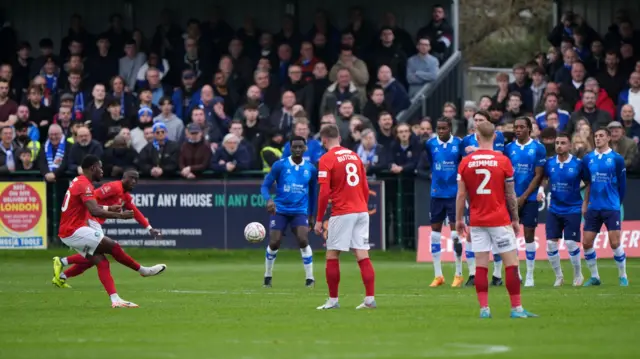 Wycombe's Beryly Lubala curls in a free-kick to give his side the lead at Wealdstone