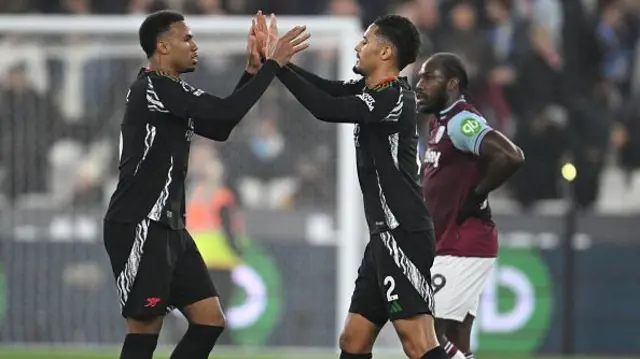 William Saliba of Arsenal celebrates with teammate Gabriel