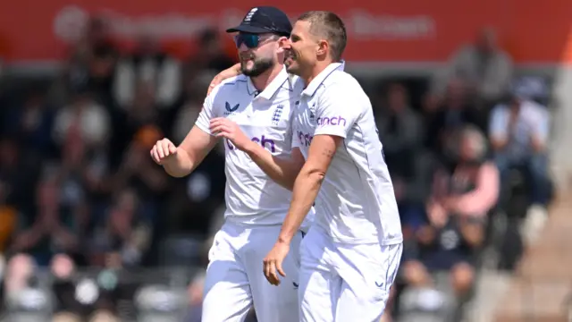 Gus Atkinson and Brydon Carse celebrate after dismissing Devon Conway