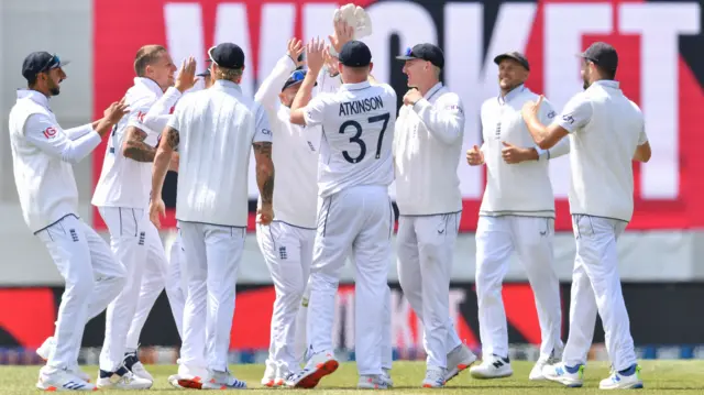 England celebrating a wicket