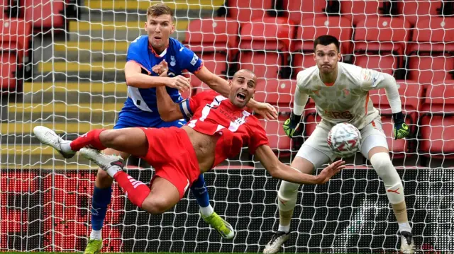 Leyton Orient's Darren Pratley goes down inside the penalty area