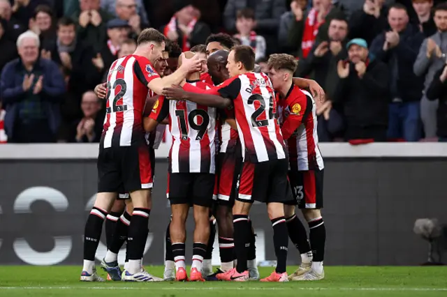 Kevin Schade of Brentford (obscured) celebrates