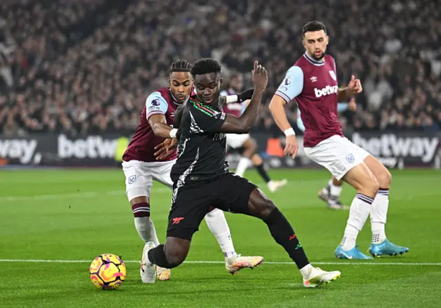 Bukayo Saka of Arsenal controls the ball.