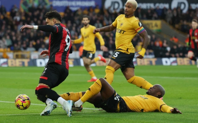 Wolverhampton Wanderers' Toti Gomes fouls AFC Bournemouth's Evanilson to concede a penalty