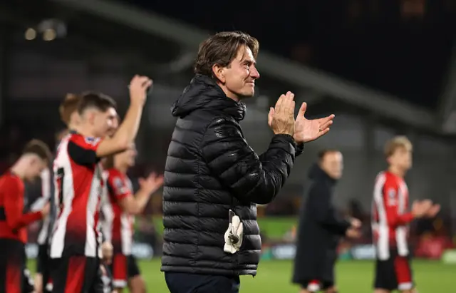 Thomas Frank, Manager of Brentford, applauds the fans