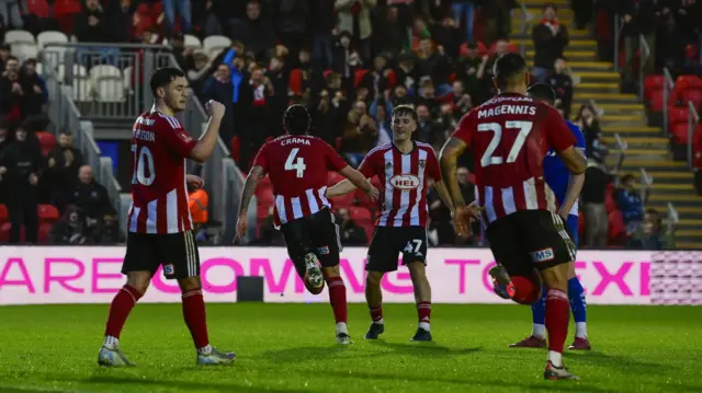 Tristan Crama sprints off to celebrate after scoring for Exeter