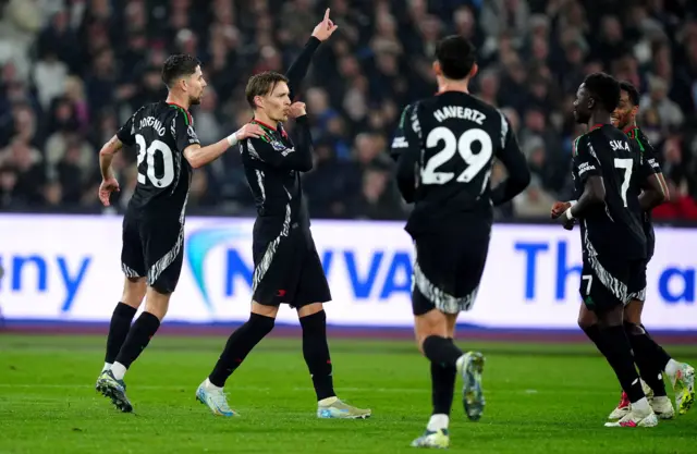 Arsenal's Martin Odegaard (second left) celebrates after scoring his sides third goal.