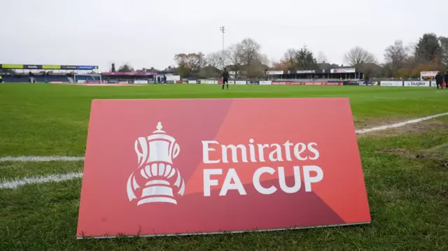 An FA Cup banner at Wealdstone's Grosvenor Vale ground