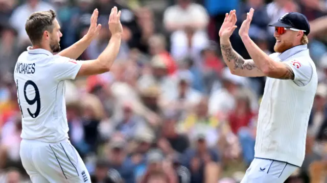 Chris Woakes and Ben Stokes celebrating after wicket