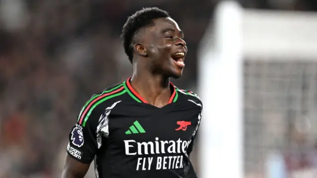 Saka celebrates after scoring against West Ham