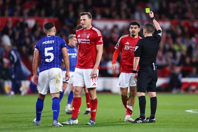 Morgan Gibbs-White of Nottingham Forest receives a yellow card.