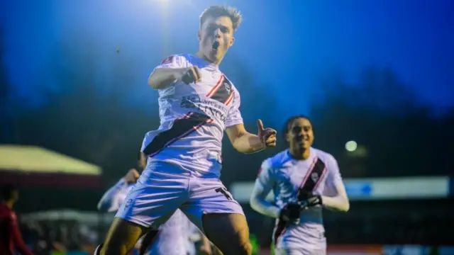 Erik Ring celebrates scoring for Lincoln