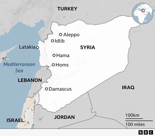 Map of Syria and bordering countries with labels for cities of Damascus, Hama, Homs, Idlib and Aleppo