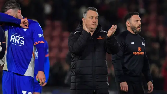 Oldham boss Mickey Mellon claps his players