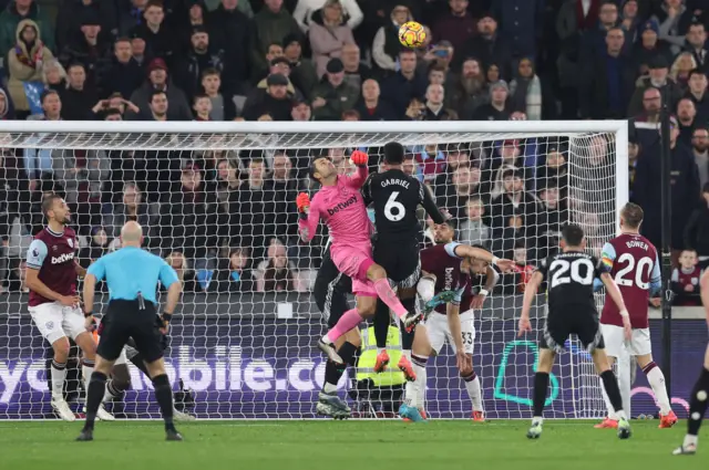 West Ham United goalkeeper Lukasz (left) Fabianski fouls Arsenal's Gabriel resulting in a penalty.