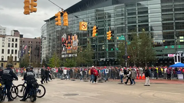 Michigan police watch as crowds gather for a Trump campaign rally in Grand Rapids. Photo: 4 November 2024