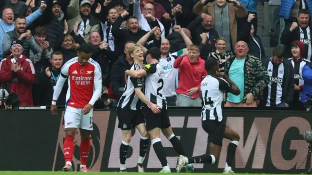 Newcastle celebrate scoring against Arsenal