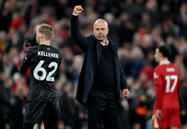 Liverpool boss Arne Slot fist pumping the crowd