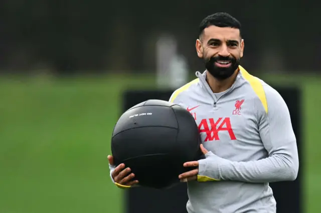 Liverpool's Egyptian striker #11 Mohamed Salah takes part in a training session